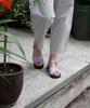Heenn Shiny Leather Crossover Sandals. Lilac