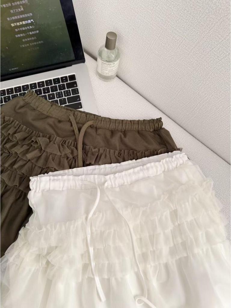 Spring 2026 Essential Korean Style Midi Skirt with Heavy Embroidery, Mesh Layers, and Lace-Up Hem.