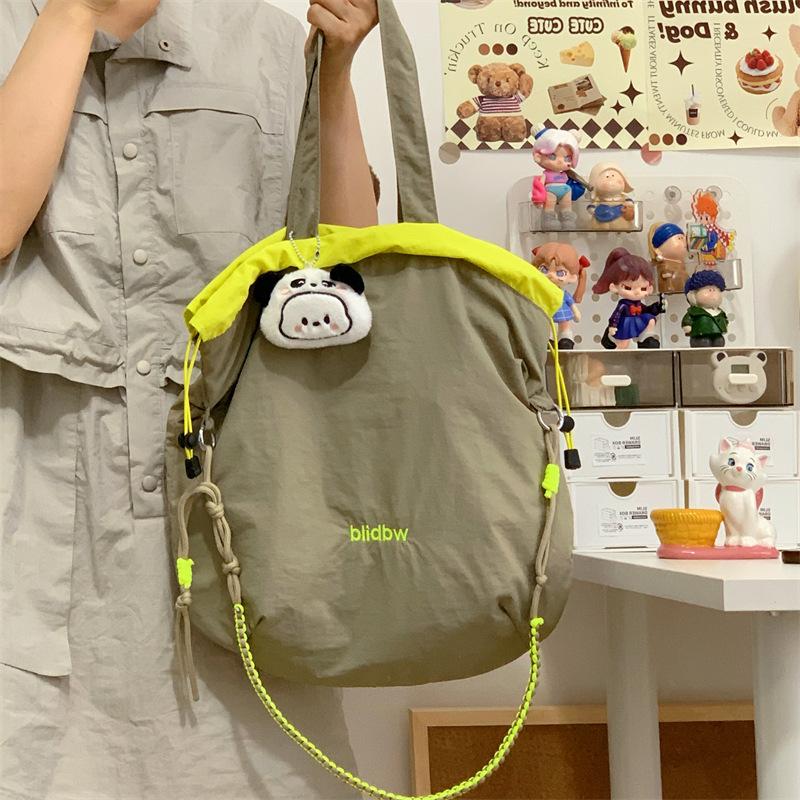 Niche Canvas Bag Color Matching Drawstring Adjustable Shoulder Strap Multi-function Hand Carry Contrasting Color Light Crossbody Shoulder Bag