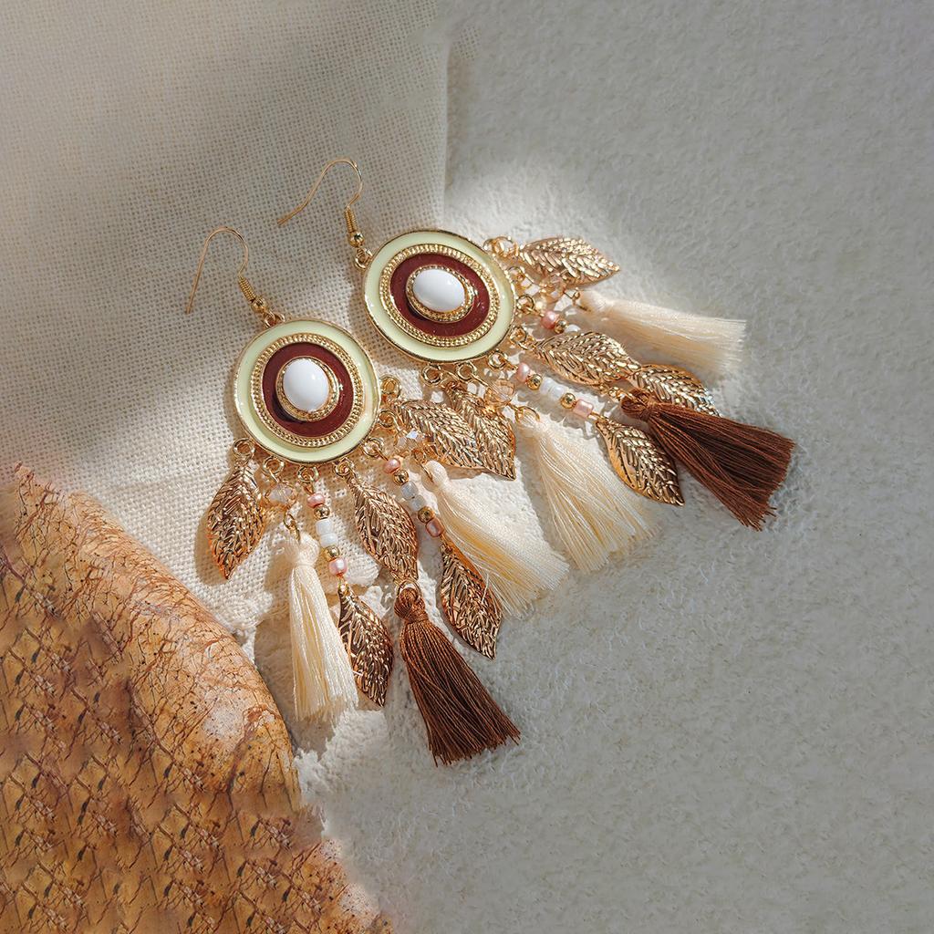 Retro ethnic style woven feathers long fringed earrings, bohemian high-end hollow rice bead earrings