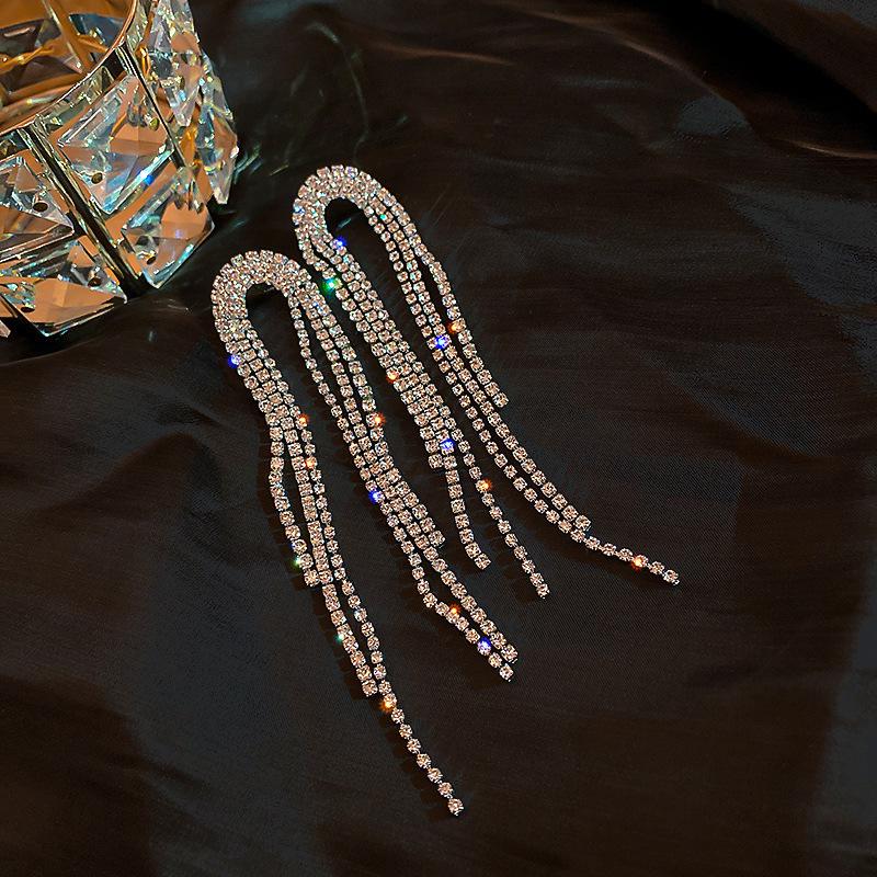 

Silver Zirconia Bow Tassel Earrings: Korean Style, Exaggerated Luxury Ear Stud Ornaments.
