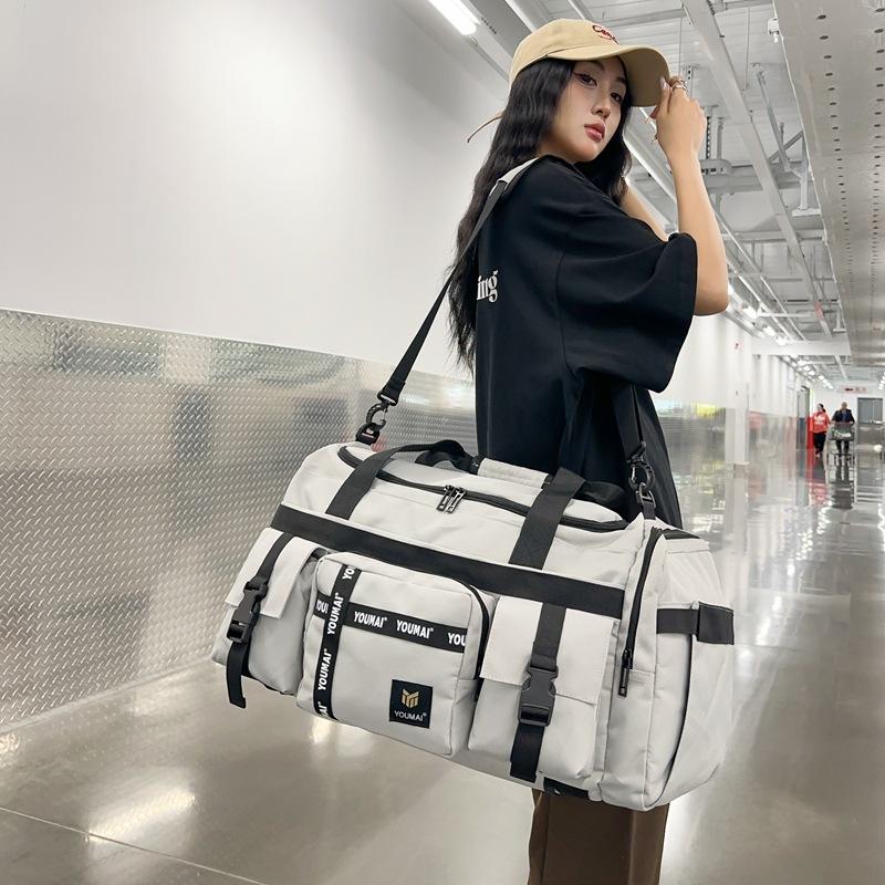 Travel bag large capacity high sense high value fitness bag dry and wet separation light backpack men's messenger bag