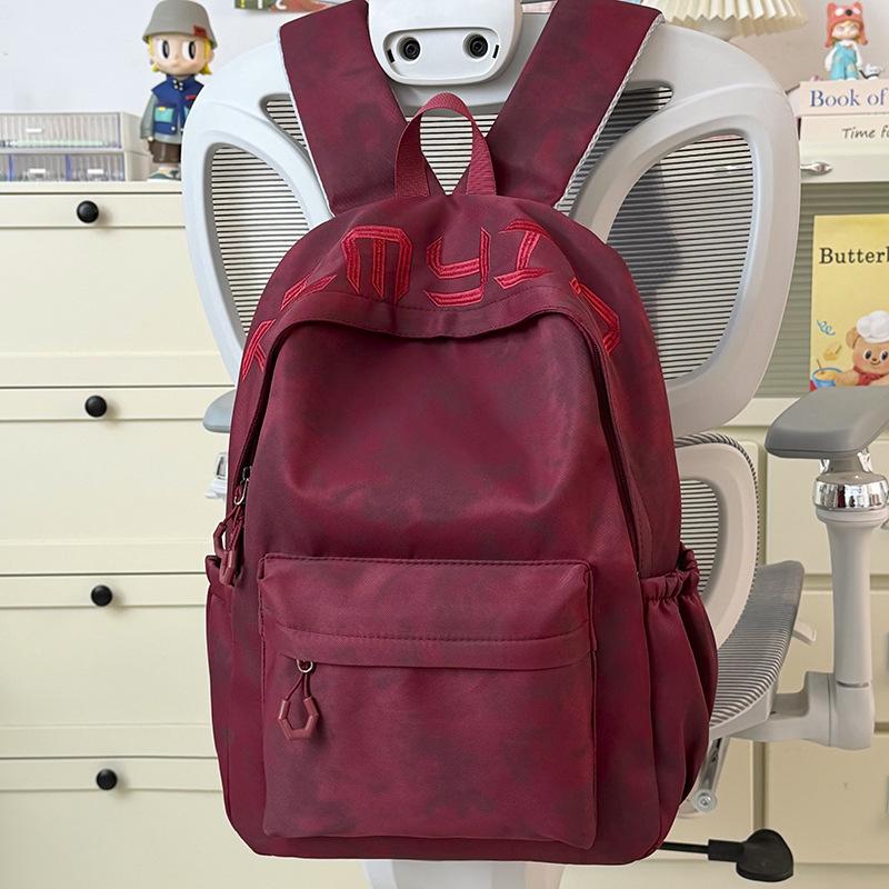 Schoolbag Japanese simple and versatile large-capacity solid color campus schoolbag 1011 summer new light commuter student backpack