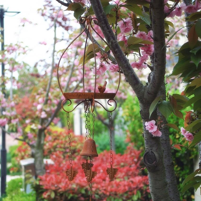 Rust-Colored Small Birdhouse Feeder with Bell Wind Chime.