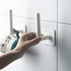 Wall-Mounted Kitchen Organizer: Punch-Free Paper Towel Holder & Cling Film Rack with Pot Lid Storage.