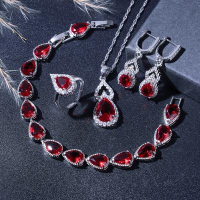 Elegante Rote Kristallbeschichtete Wassertropfen Hochzeits-Schmucksets Für Frauen Ohrringe Halskette Verstellbarer Ring Armband