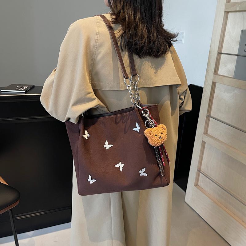 

Вместительная серебристая сумка женская 2025 новая популярная сумка-тоут женская мода для студентов на занятиях на плечо 32*12*26 темно-коричневого