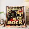 A rock concert poster with bold skull, flames, and musical motifs. for all seasons blanket lunch break throw gift