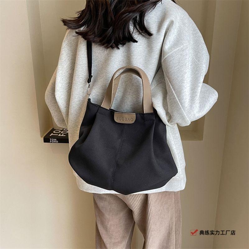 Casual canvas bag women's new versatile simple shoulder handbag fashionable large-capacity student class shoulder bag