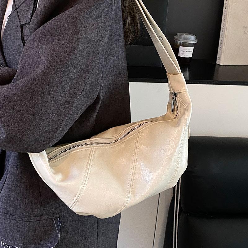 2025 new casual simple Hong Kong style soft leather shoulder dumpling bag fashionable versatile high sense commuter messenger women's bag