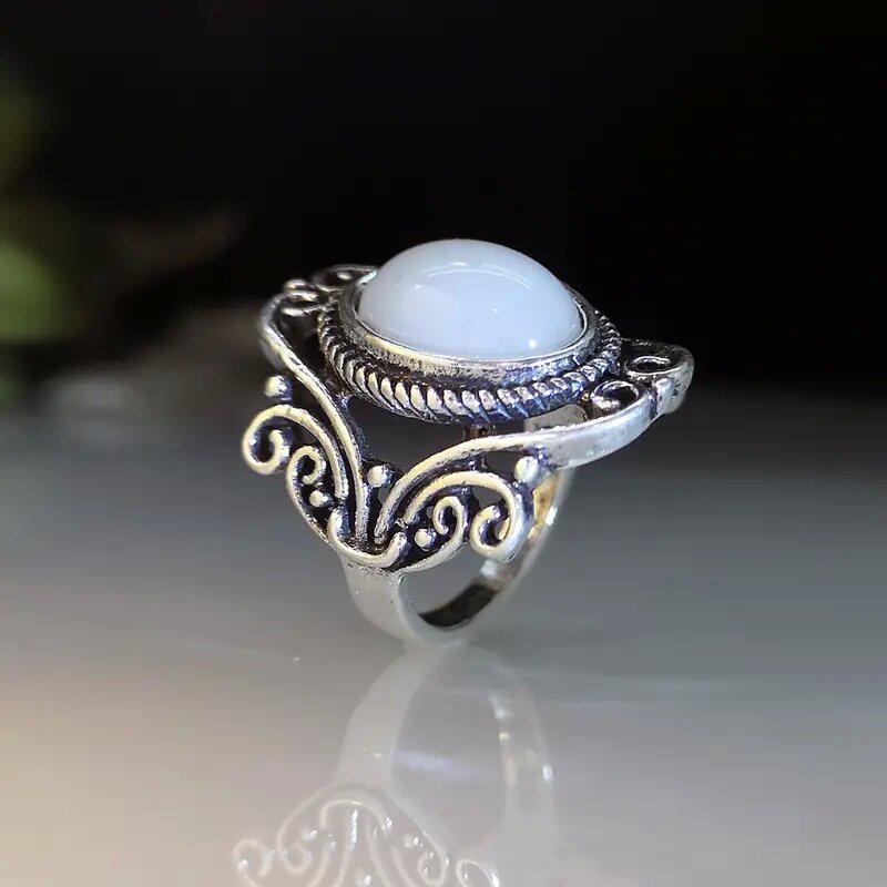 Retro inlaid imitation moonstone ring, hot-selling women's ring in Europe and America, geometric hollow engraved retro ring