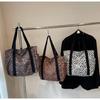 Leopard Print Canvas Tote: Large Capacity Autumn Shoulder Bag for Women, Versatile for College and Commute.