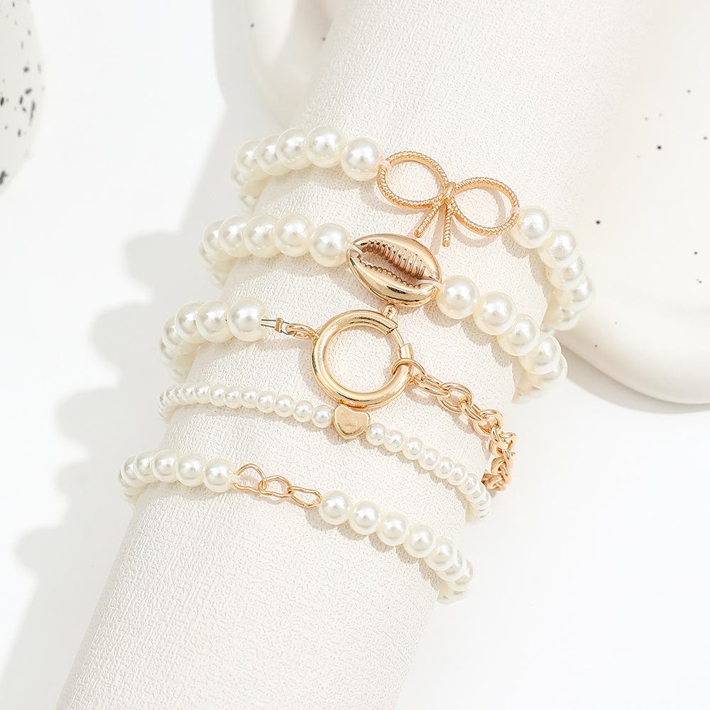 5-Piece Ocean-Inspired Faux Pearl Bracelet Set for Women with Bow, Heart, and Shell Accents