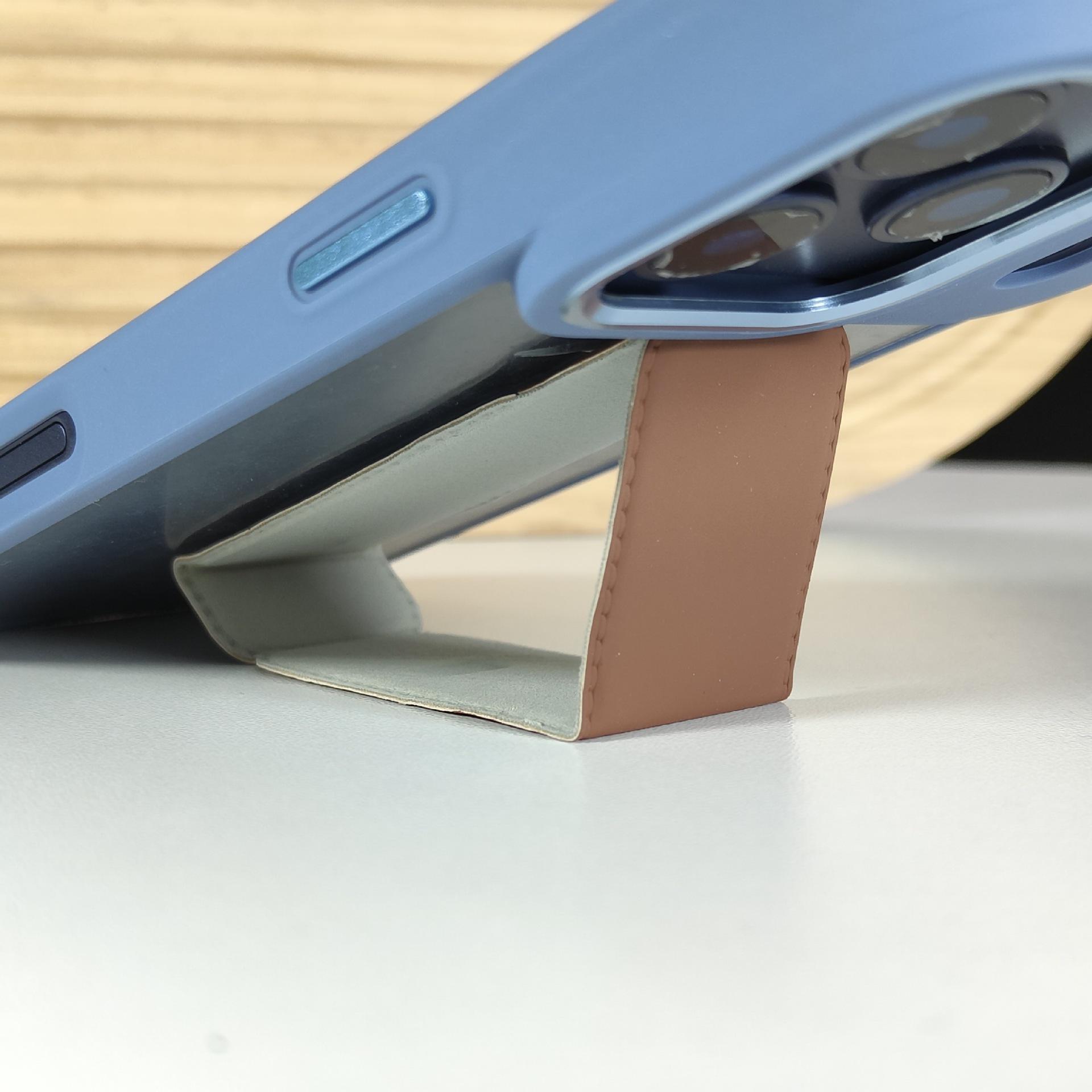 

Universal PU Leather Phone Stand: Magnetic, Stick-On Holder for Foldable Android, Apple, and Huawei Devices Lazy Stand