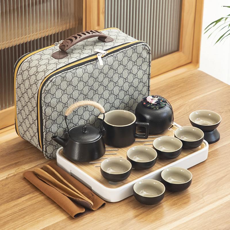 Black pottery travel kung fu tea set portable business gift set creative ceramic cooling pot set