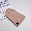Autumn and winter smiley face labeling wool hat solid color couple versatile warm knitting classic casual hat men and women tide
