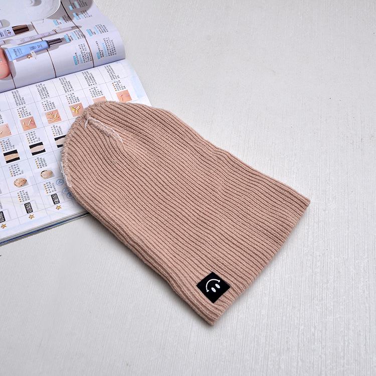Autumn and winter smiley face labeling wool hat solid color couple versatile warm knitting classic casual hat men and women tide