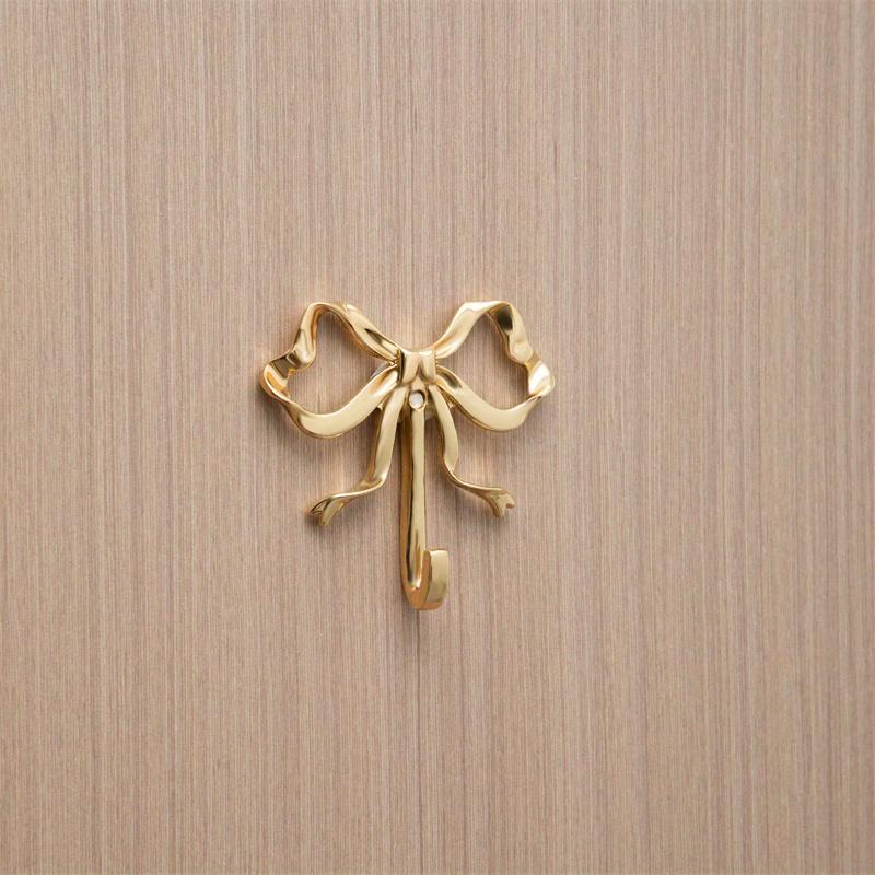 

A Stylish Golden Rust-resistant Butterfly Hook For Use In Bedrooms, Bathrooms, And Other Places. Small