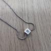 Used moschino silver necklace square dice