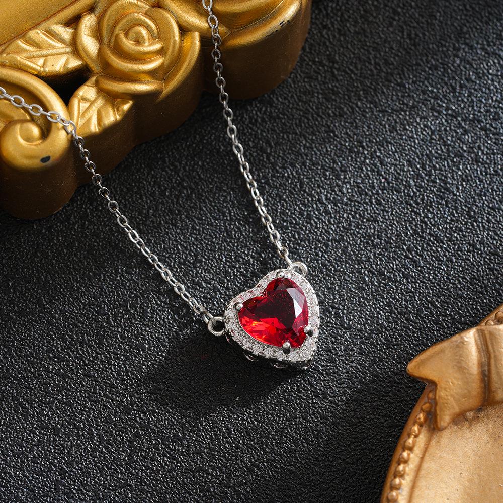 Titanium Steel Sword & Red Heart Necklace Set with Micro-Set Cubic Zirconia Arrow and Layered Clavicle Chain.