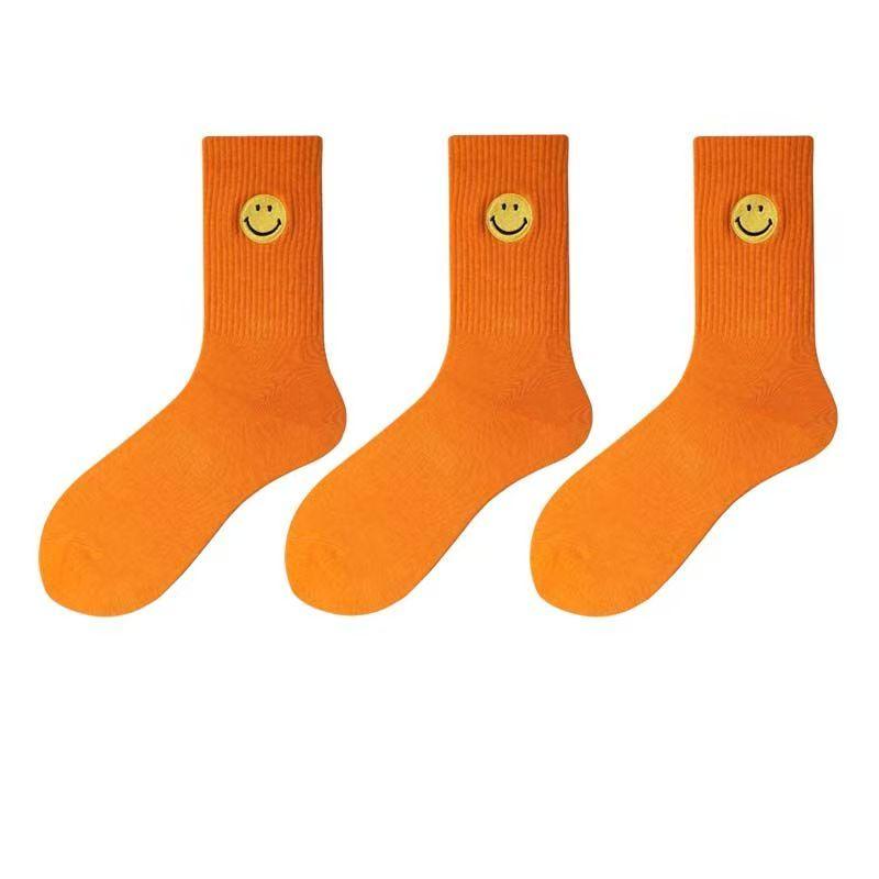 Einfarbige, mittellange Socken mit frischem, lächelndem Gesichtsmuster, schlichtem Design, bequem und atmungsaktiv.