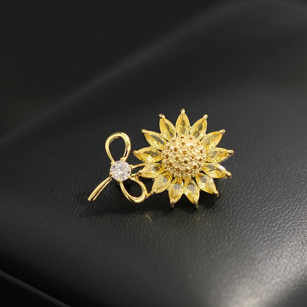 Korean version of sweet and delicate diamond-encrusted yellow sunflower small pin temperament versatile women s anti-light small brooch accessories