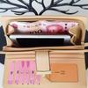 Youthful Embossed Long Wallet: Three-in-One Coin Purse, Anti-Magnetic, Multi-Card Slot Holder, with Elegant Cutout Design.