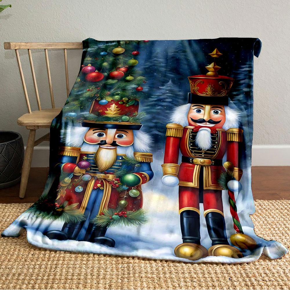 Two Festive Nutcracker Figures, One In Red and One In Blue, In Snowy Scenery. for All Seasons Blanket Lunch Break Throw Gift