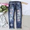 Jeans elasticizzati stampati a fiori blu da donna Pantaloni a vita alta Pantaloni skinny strappati con toppe in denim distrutto
