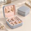 Zippered Leather-Material Jewelry Storage Case with Lid Hooks, Interior Pocket, Ring Rolls, and Removable Dividers