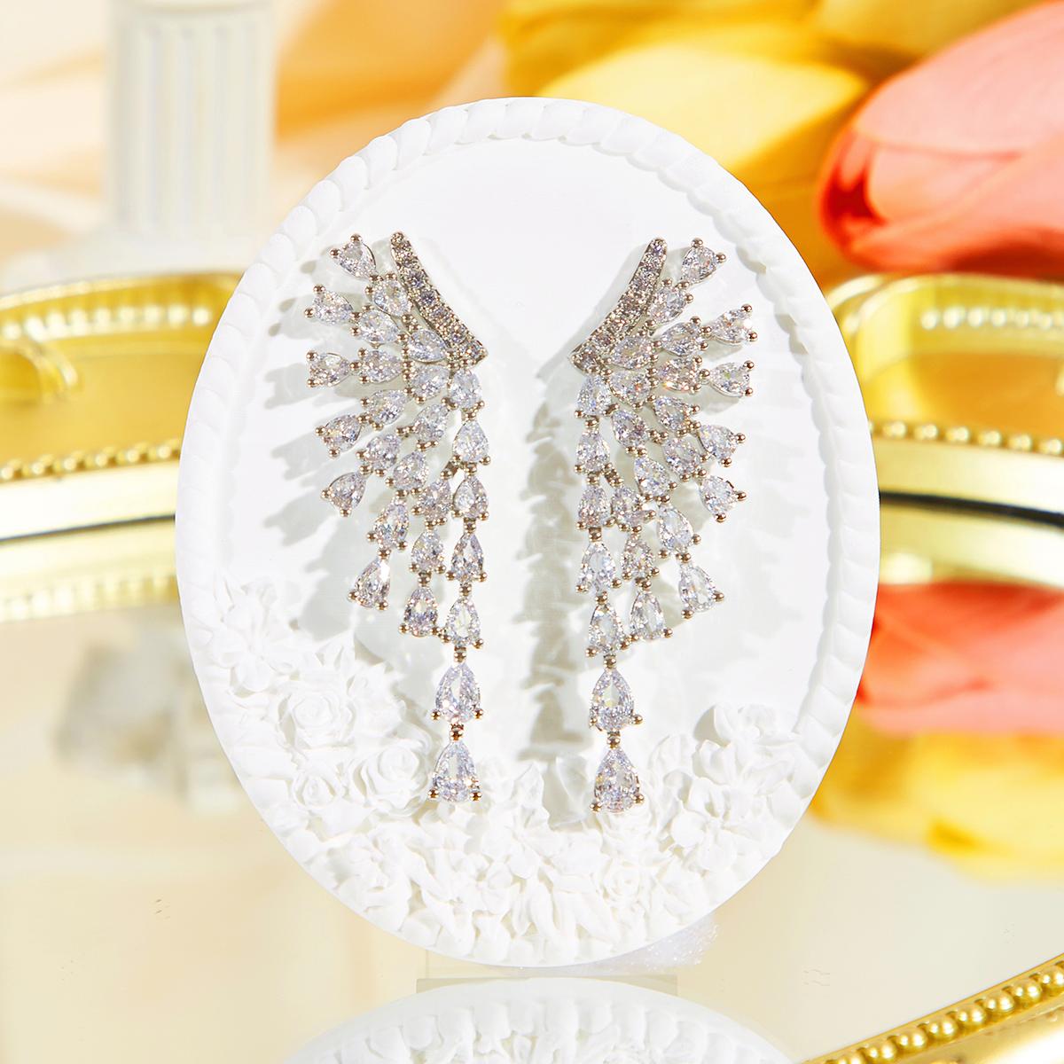 

CMM супер блестящие серьги-подвески с каплями воды и цирконием в форме крыла с кисточками, дизайнерское чувство индивидуальности, преувеличенные свадебные украшения серебряный