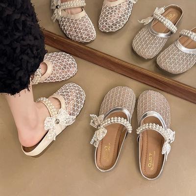 Zapatillas de verano para mujer con cabeza de bolsa de fondo plano estilo francés 2025 nuevo diseño de un solo pedal estilo hada de malla zapatos de rejilla zapatillas frescas