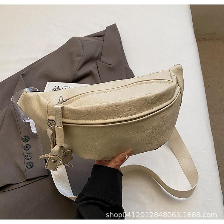 2025 new personalized foreign style women's small breast bag casual simple solid color wide shoulder strap waist bag single shoulder messenger bag wom