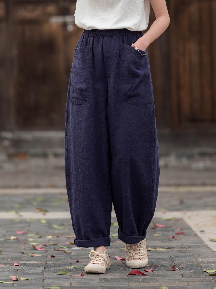 

Johnature Women Vintage Harem Pants Solid Color Patchwork Pockets Trousers Elastic Waist Loose Pants One Size темно-синього кольору