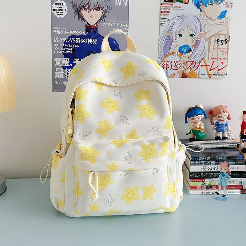 Nowy tornister jest wysokiej jakości, świeży, słodki i uroczy, a plecak w gwiazdki to lekki plecak podróżny dla uczniów gimnazjum.