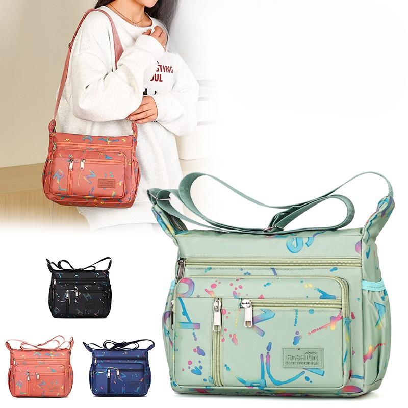 New Fashion Joker Shoulder Bag Large Capacity Letter Printing Leisure Travel Messenger Bag Multi Layer Storage Mother Bag.