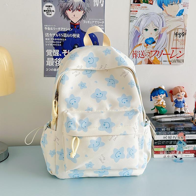 Nowy tornister jest wysokiej jakości, świeży, słodki i uroczy, a plecak w gwiazdki to lekki plecak podróżny dla uczniów gimnazjum.