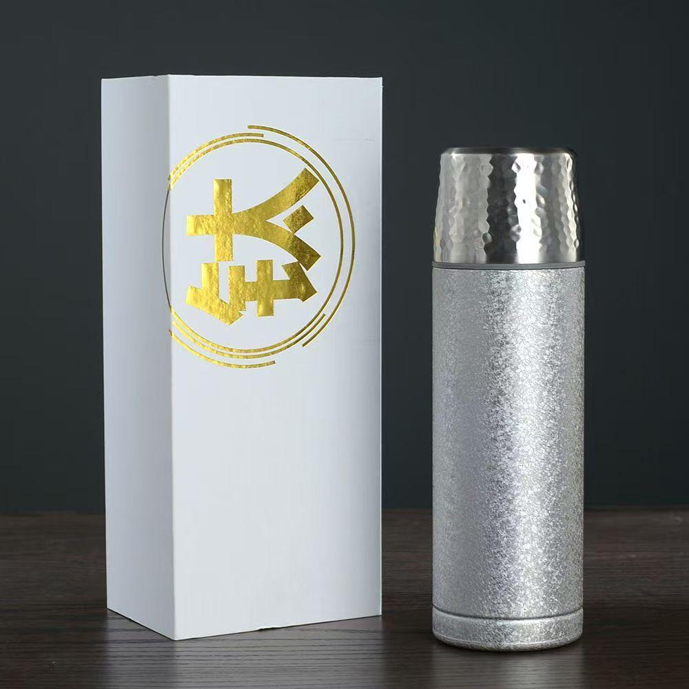 Light luxury hammer pattern titanium covered thermos cup fashionable tea separation ice crystal health tea cup high-end business gift titanium cup