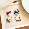 Asymmetrical Poker Rabbit Bowknot Earrings with Silver Needle Stud and No-Pierce Clip.