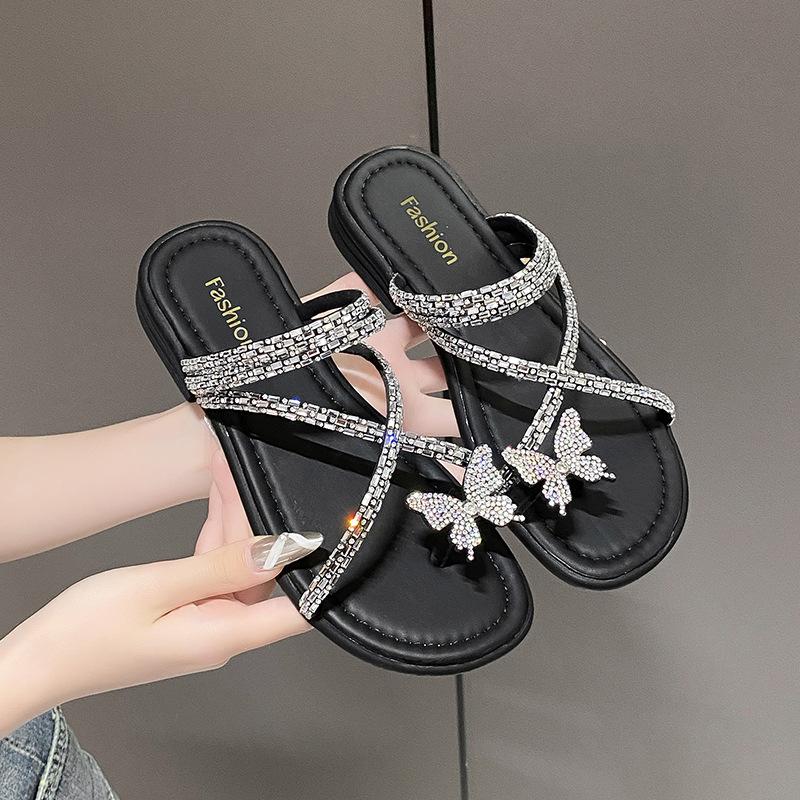 

Красивые шлепанцы на плоской подошве для женской летней носки 2025 новые стразы-бабочки с юбками и двумя сандалиями. 35 чёрный