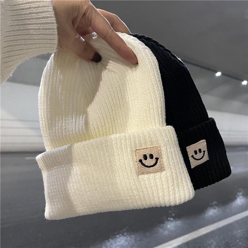Cute smiley face label wool hat women's autumn and winter warm trend versatile ear protector black knitted hat men