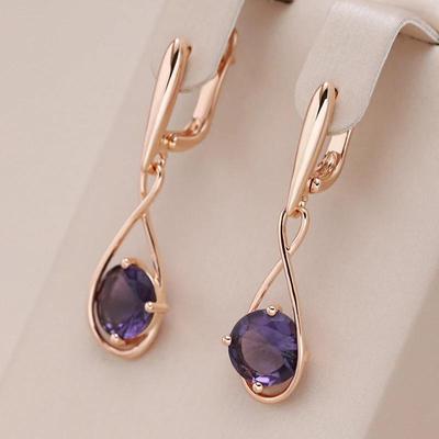 Orecchini pendenti stile incrocio con zirconi viola per le donne Gioielli di lusso alla moda con luce dorata che mantengono il colore