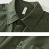 Frühling und Sommer 100 Baumwolle Langarm Herrenhemd Täglich Vielseitiges Freizeit-Oberteil Einfarbiges Hemd mit Tasche Schlichter Stil Herrenbekleidung
