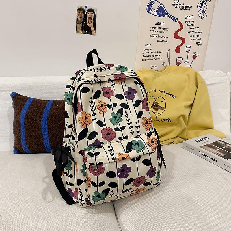 High-value schoolbag women's large capacity new fashion small floral backpack Japanese junior high and high school student backpack