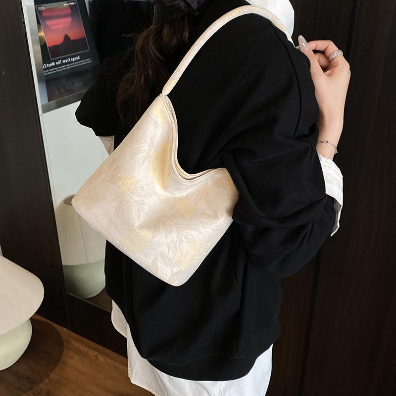 Fashion trend niche design bucket bag 2025 summer new casual texture women's shoulder messenger bag