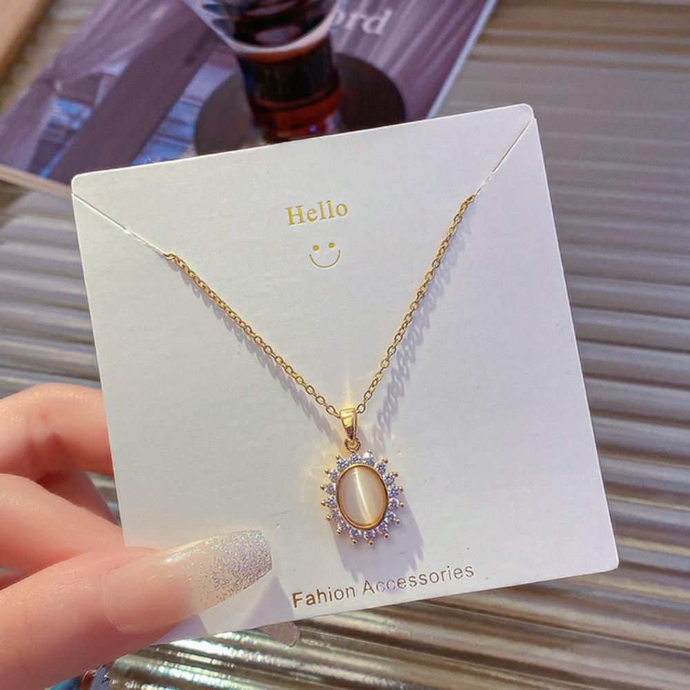 

2026 Elegant Cat s Eye Stone Flower Necklace - Vintage Gold Plated Titanium Steel Zircon Halo Pendant for Women