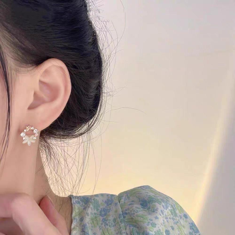 Boucles d'oreilles pendantes élégantes 2025 avec fleur en zircon œil-de-chat français et aiguilles en argent 925