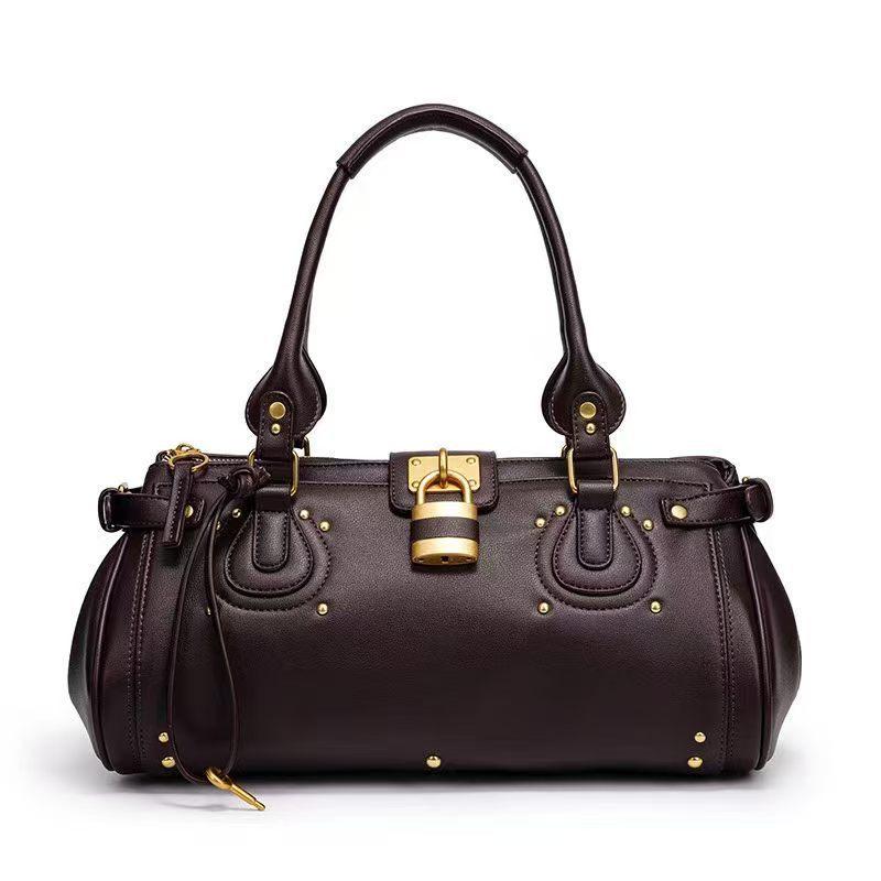 Herbst und Winter Retro Nietenverschluss Kopf Achseltasche Umhängetasche Schultertasche Damen