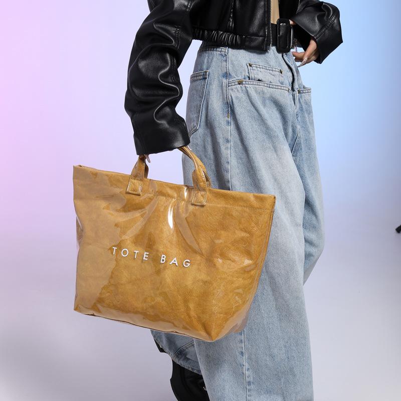 

Large capacity printed alphabet portable tote bag, new fashion flow versatile casual retro women s bag 34*15*30 коричневый