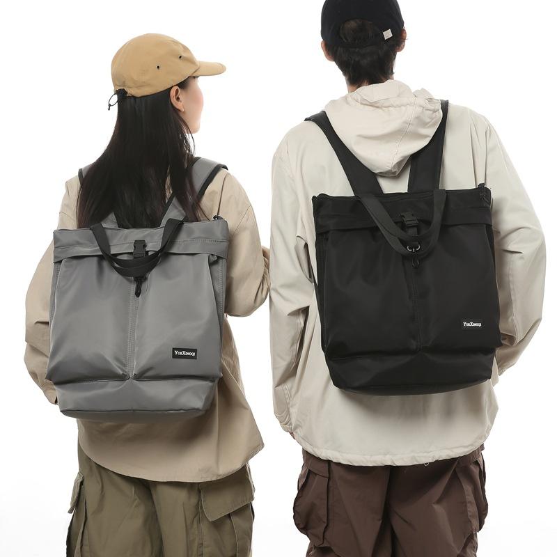 Mochila para Homens e Mulheres para Deslocamento Bolsa de Mão Cor Sólida Casual Bolsa Tote de Ombro Único Grande Capacidade Mochila de Nylon Resistente a Salpicos Moderna